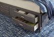 Caitbrook Queen Storage Bed with 8 Drawers with Dresser and Chest Tuscaloosa Furniture Outlet