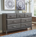 Caitbrook Queen Storage Bed with 8 Drawers with Dresser and Chest Tuscaloosa Furniture Outlet