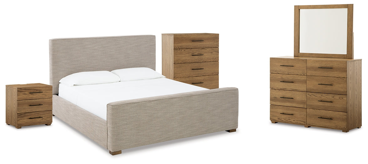 Dakmore King Upholstered Bed with Mirrored Dresser, Chest and Nightstand Tuscaloosa Furniture Outlet