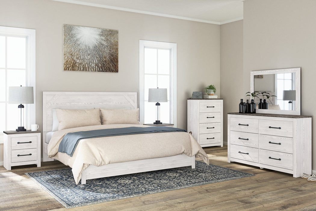 Gerridan King Panel Bed with Mirrored Dresser, Chest and 2 Nightstands Tuscaloosa Furniture Outlet