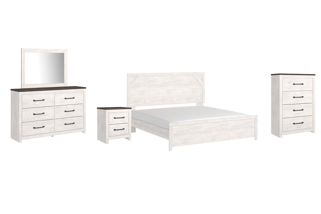 Gerridan King Panel Bed with Mirrored Dresser, Chest and Nightstand Tuscaloosa Furniture Outlet