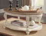 Realyn Coffee Table with 1 End Table Tuscaloosa Furniture Outlet